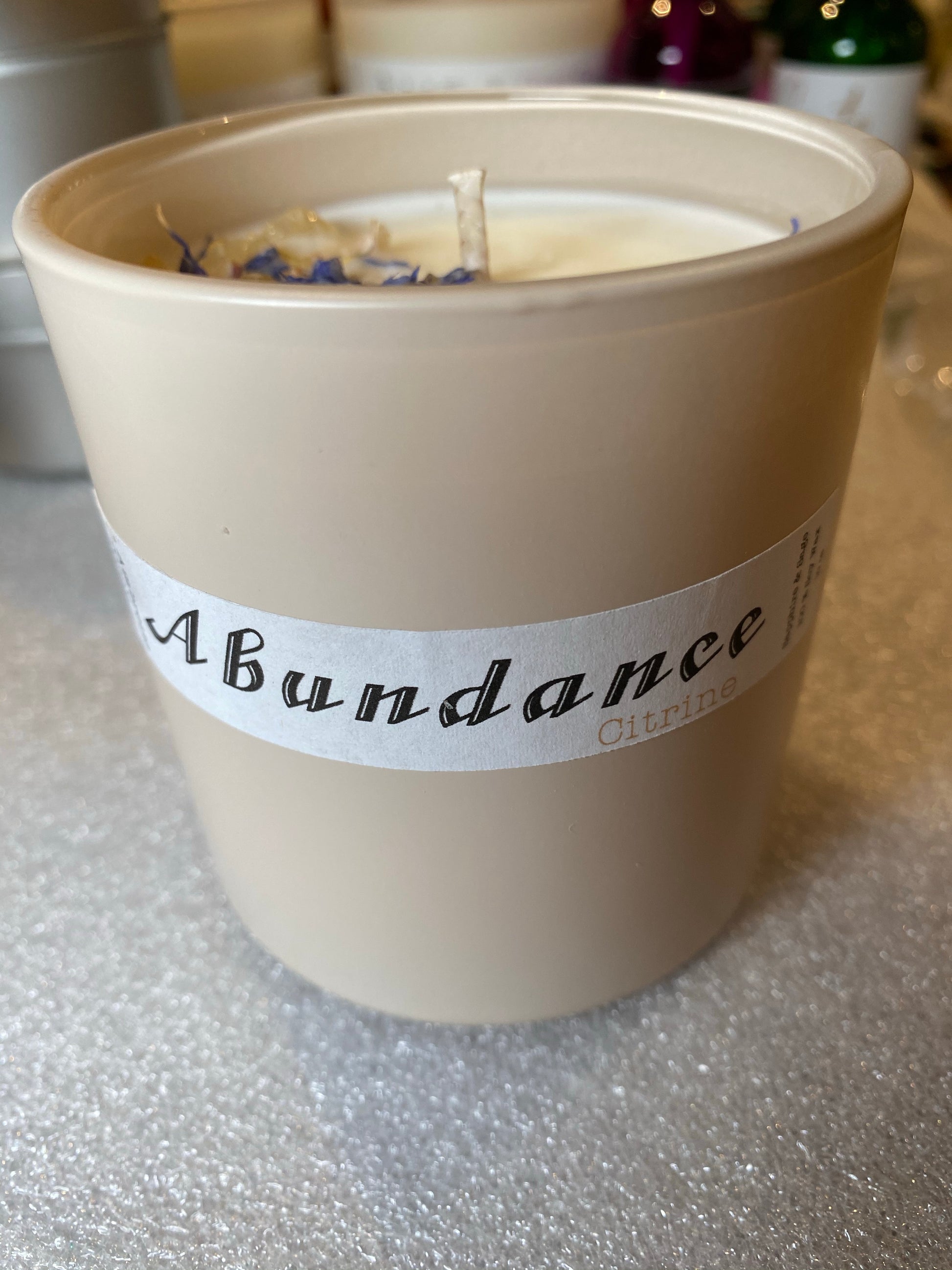 100% soy candle with a fig + poppy + ambertte scent topped with citrine 